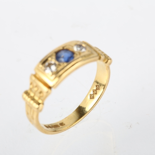 1183 - A late 20th century 18ct gold three stone sapphire and diamond ring, maker ARW, London 1984, setting... 