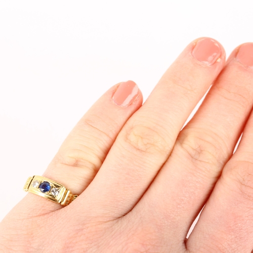 1183 - A late 20th century 18ct gold three stone sapphire and diamond ring, maker ARW, London 1984, setting... 