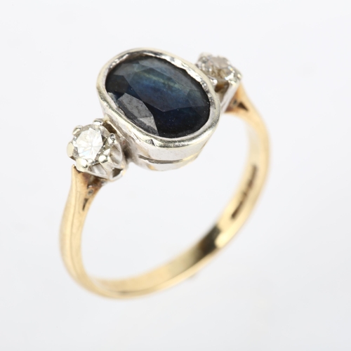 1196 - A late 20th century 9ct gold three stone sapphire and diamond ring, London 1992, rub-over set with 2... 