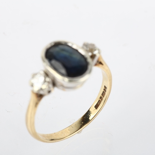 1196 - A late 20th century 9ct gold three stone sapphire and diamond ring, London 1992, rub-over set with 2... 