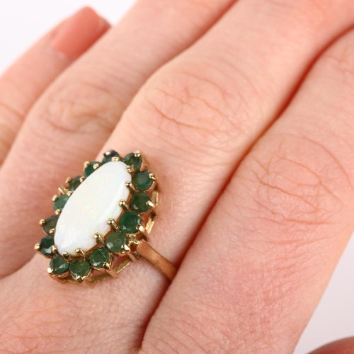 1202 - A late 20th century 9ct gold opal and emerald oval cluster ring, maker RJ, London 1976, claw set wit... 