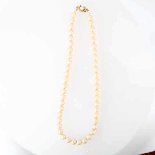 1206 - A single-strand pearl bead necklace, with 14ct ruby clasp, 8mm pearls, 38cm, 40.8g