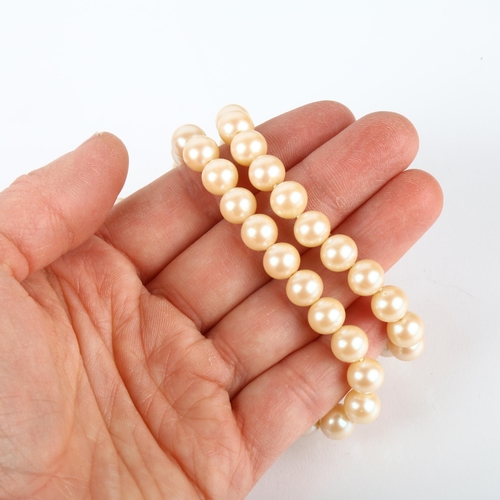 1206 - A single-strand pearl bead necklace, with 14ct ruby clasp, 8mm pearls, 38cm, 40.8g