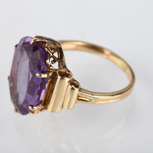 1208 - A late 20th century synthetic sapphire dress ring, unmarked gold set with oval mixed-cut synthetic s... 