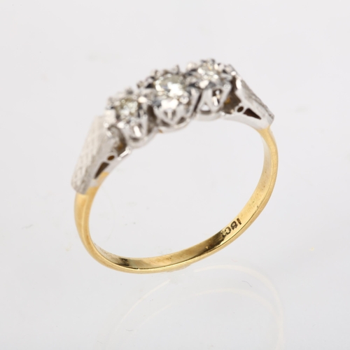 1210 - A mid-20th century 18ct gold three stone diamond ring, illusion set with modern round brilliant-cut ... 