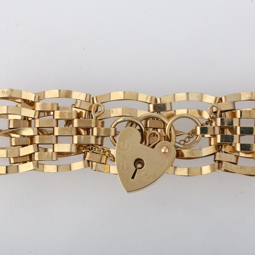 1211 - A 9ct gold gatelink bracelet, London 1978, with 9ct heart padlock clasp, 18cm, 10.9g