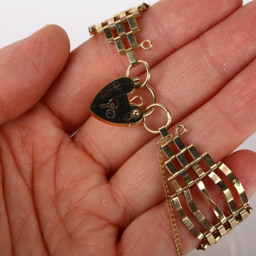 1211 - A 9ct gold gatelink bracelet, London 1978, with 9ct heart padlock clasp, 18cm, 10.9g