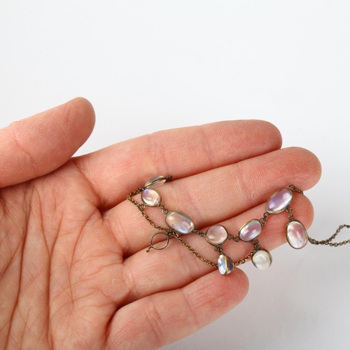 1216 - An Edwardian moonstone fringe necklace, set with oval cabochon moonstones, apparently unmarked, 32cm... 