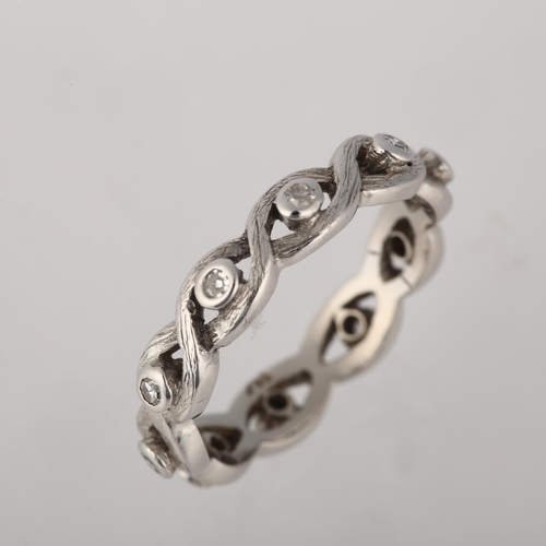 1224 - An 18ct white gold diamond full eternity ring, rub-over set with single-cut diamonds and woven band,... 