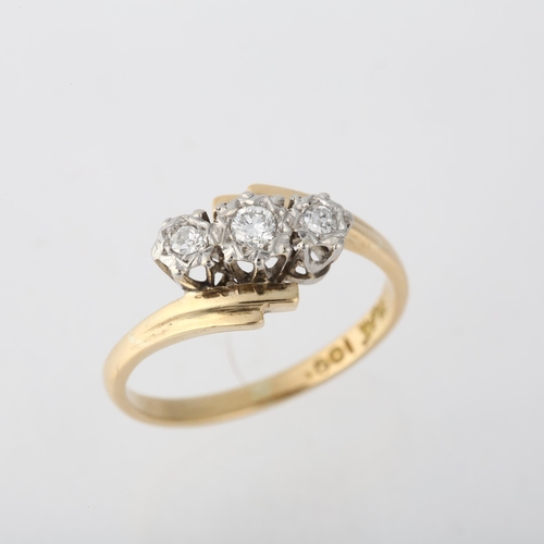 1225 - An 18ct gold three stone diamond crossover ring, platinum illusion set with modern round brilliant-c... 