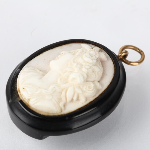 1237 - A 19th century coral cameo pendant, relief carved depicting Classical female profile, 40.4mm, 10.6g