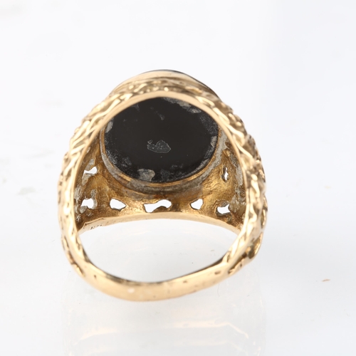 1238 - A large 9ct gold onyx signet ring, circa 1970s, setting height 25.1mm, size approx P, 10.6g