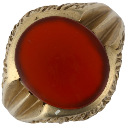 1239 - A 9ct gold carnelian signet ring, circa 1970s, setting height 17.5mm, size Q, 5.5g