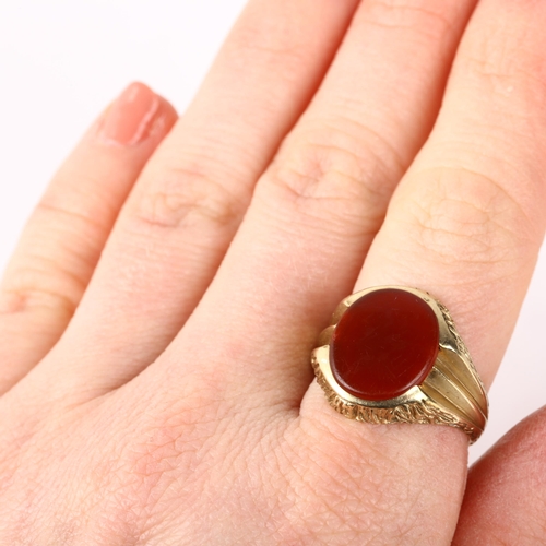 1239 - A 9ct gold carnelian signet ring, circa 1970s, setting height 17.5mm, size Q, 5.5g