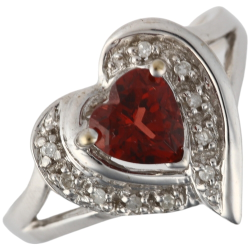 1243 - A modern 9ct white gold garnet and diamond heart cluster ring, setting height 13.9mm, size P, 3.1g