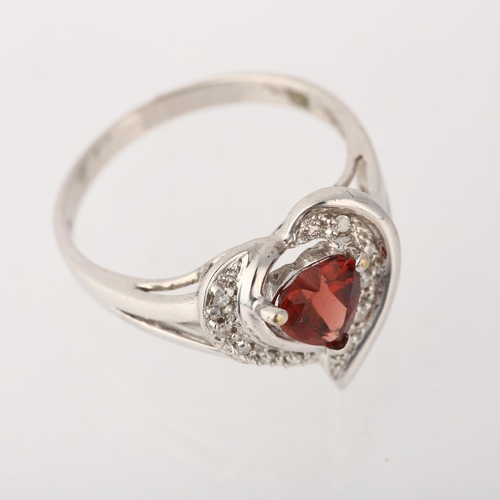 1243 - A modern 9ct white gold garnet and diamond heart cluster ring, setting height 13.9mm, size P, 3.1g