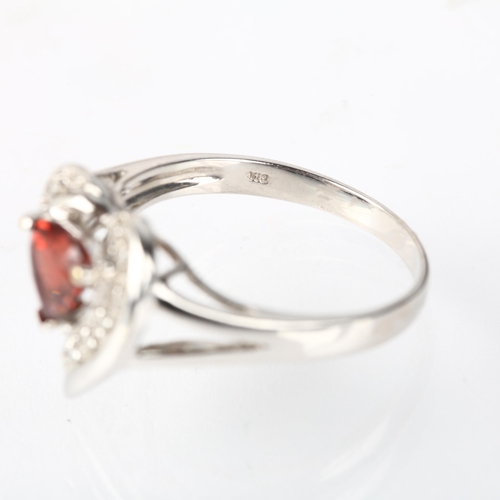 1243 - A modern 9ct white gold garnet and diamond heart cluster ring, setting height 13.9mm, size P, 3.1g