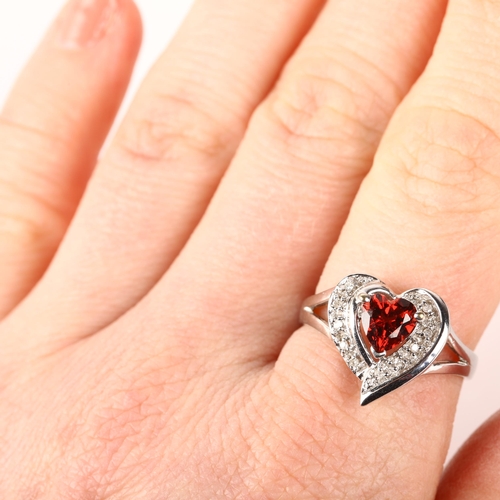 1243 - A modern 9ct white gold garnet and diamond heart cluster ring, setting height 13.9mm, size P, 3.1g