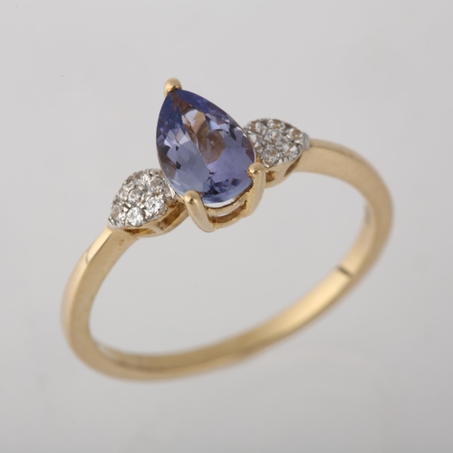 1249 - A 9ct gold tanzanite and cubic zirconia dress ring, claw set with pear-cut tanzanite, setting height... 