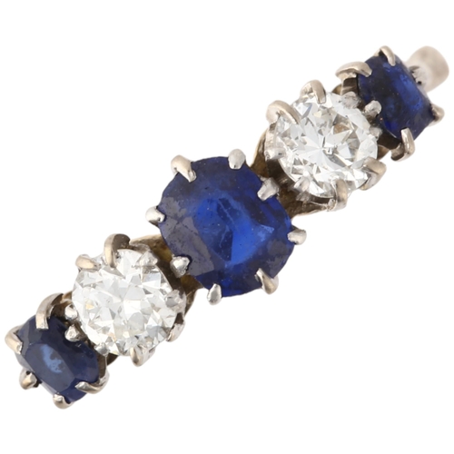 1253 - An 18ct gold graduated five stone sapphire and diamond ring, claw set with oval mixed-cut sapphires ... 