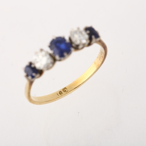 1253 - An 18ct gold graduated five stone sapphire and diamond ring, claw set with oval mixed-cut sapphires ... 