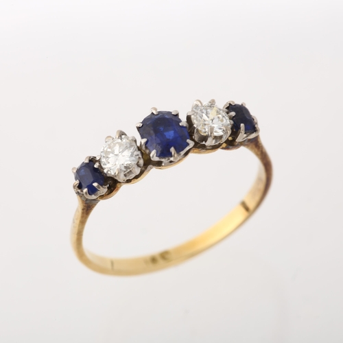 1253 - An 18ct gold graduated five stone sapphire and diamond ring, claw set with oval mixed-cut sapphires ... 