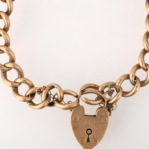 1255 - An early 20th century 9ct rose gold hollow curb link chain bracelet, with 9ct heart padlock clasp, 1... 