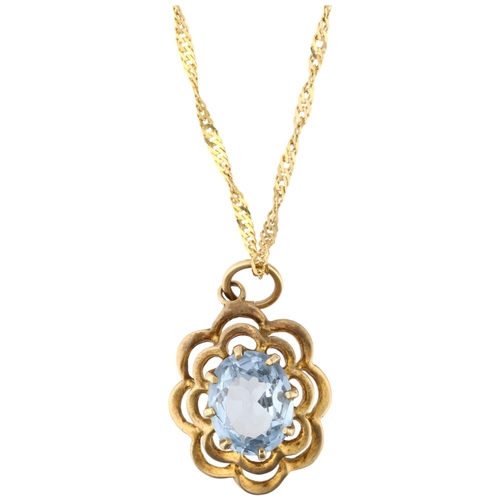 1257 - A late 20th century 9ct gold blue topaz flowerhead pendant necklace, London 1972, on 9ct Prince of W... 