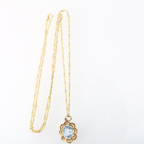 1257 - A late 20th century 9ct gold blue topaz flowerhead pendant necklace, London 1972, on 9ct Prince of W... 