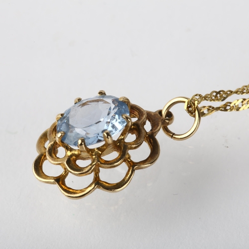 1257 - A late 20th century 9ct gold blue topaz flowerhead pendant necklace, London 1972, on 9ct Prince of W... 