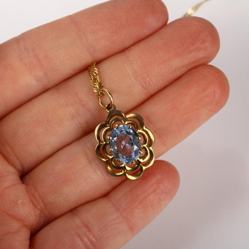 1257 - A late 20th century 9ct gold blue topaz flowerhead pendant necklace, London 1972, on 9ct Prince of W... 