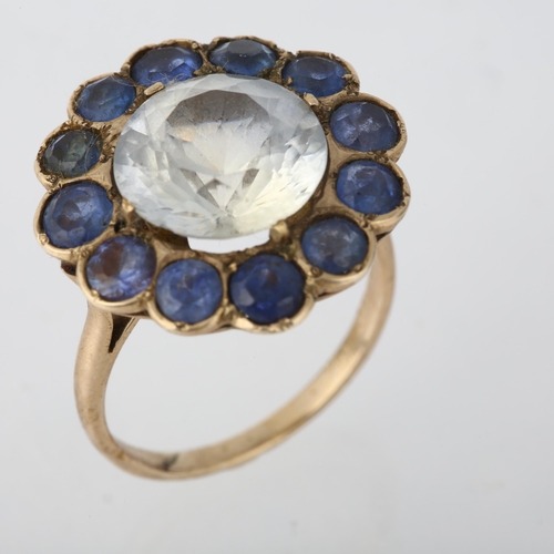 1266 - A large late 20th century synthetic sapphire flowerhead cluster ring, set with round-cut white and b... 