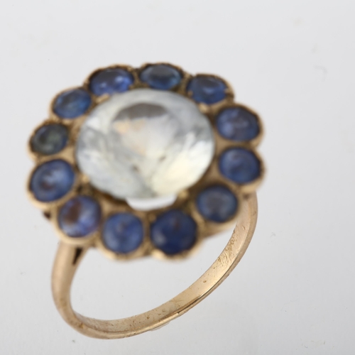 1266 - A large late 20th century synthetic sapphire flowerhead cluster ring, set with round-cut white and b... 