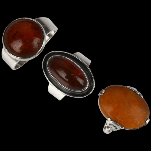 1384 - 3 Danish silver and amber rings, makers include Niels Erik From, sizes J, N, and V, 13.8g total (3)