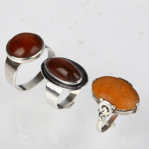 1384 - 3 Danish silver and amber rings, makers include Niels Erik From, sizes J, N, and V, 13.8g total (3)