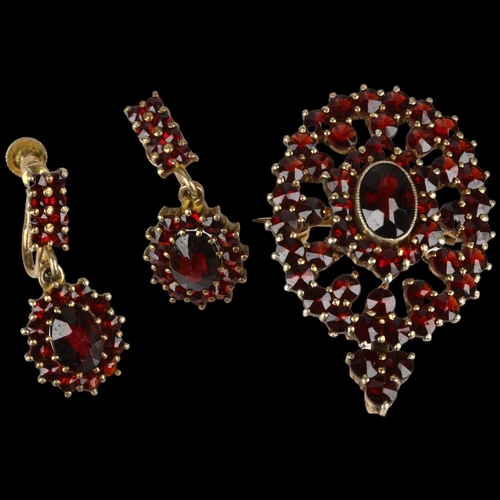 1387 - An Austrian 900 silver-gilt Bohemian garnet pendant/brooch and earring set, pendant 34.3mm, earrings... 