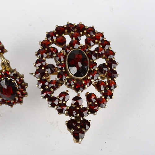 1387 - An Austrian 900 silver-gilt Bohemian garnet pendant/brooch and earring set, pendant 34.3mm, earrings... 