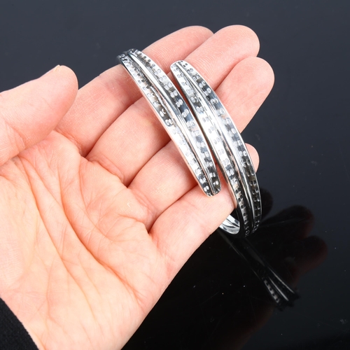 1401 - DAVID ANDERSEN - a Norwegian sterling silver Viking Revival torque bangle, a copy of an original fro... 