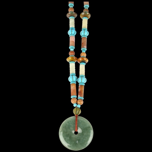 1405 - A large Chinese jade and serpentine bi disc necklace, diameter 55.2mm, necklace 70cm, 170g