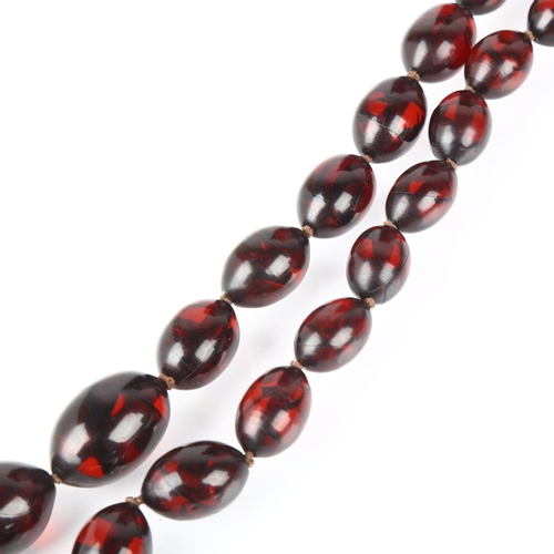 1419 - A graduated single-strand Cherry Bakelite bead necklace, beads measure 27.0 - 15.7mm, necklace 80cm,... 