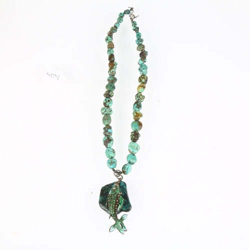 1434 - A single-strand graduated turquoise matrix bead necklace, with enamel articulated fish pendant, 36cm... 