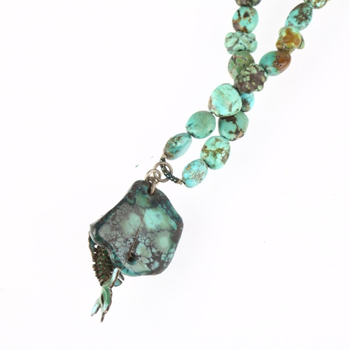 1434 - A single-strand graduated turquoise matrix bead necklace, with enamel articulated fish pendant, 36cm... 