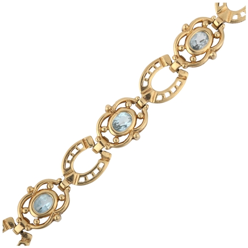 1278 - A late 20th century 9ct gold blue topaz horse shoe panel bracelet, 19cm, 16.6g