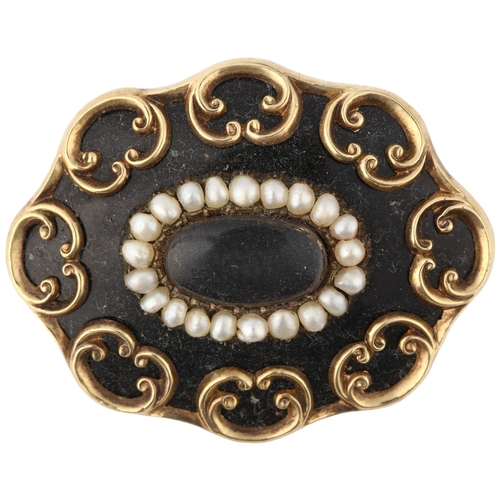 1282 - A Victorian black enamel and split pearl mourning brooch, central moire silk panel beneath convex gl... 