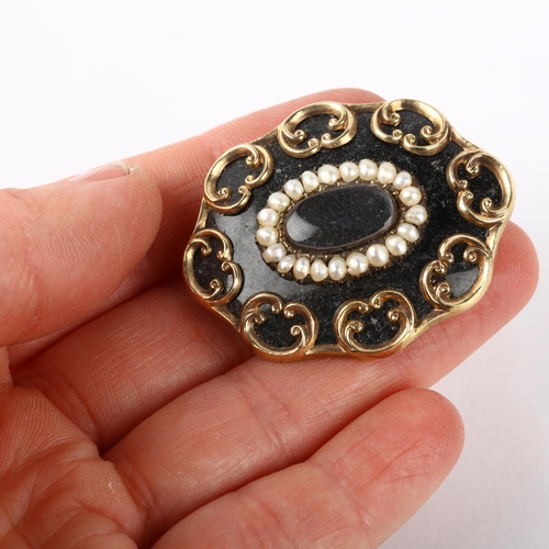 1282 - A Victorian black enamel and split pearl mourning brooch, central moire silk panel beneath convex gl... 