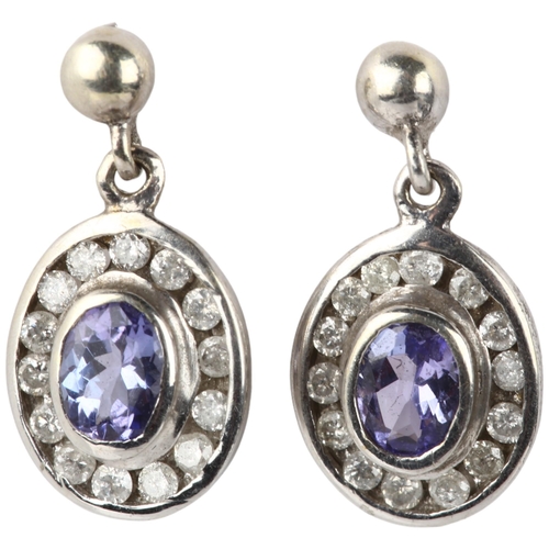 1291 - A pair of 9ct white gold tanzanite and diamond oval cluster drop earrings, with stud fittings, 13.8m... 