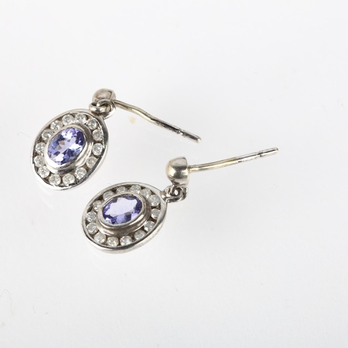 1291 - A pair of 9ct white gold tanzanite and diamond oval cluster drop earrings, with stud fittings, 13.8m... 