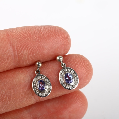 1291 - A pair of 9ct white gold tanzanite and diamond oval cluster drop earrings, with stud fittings, 13.8m... 