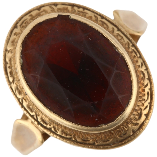 1294 - A 9ct gold garnet dress ring, rub-over set with oval mixed-cut garnet, setting height 18.2mm, size N... 