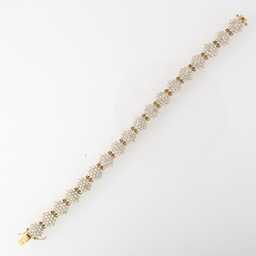 1298 - An 18ct gold diamond snowflake cluster line bracelet, maker LA, import Sheffield 1998, claw set with... 